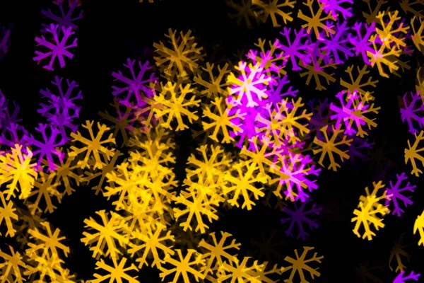 Abstract Yellow Purple lights snow flake bokeh background