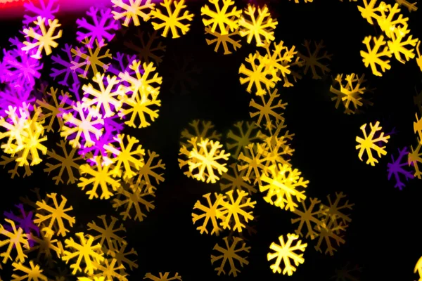 Abstract Yellow Purple lights snow flake bokeh background