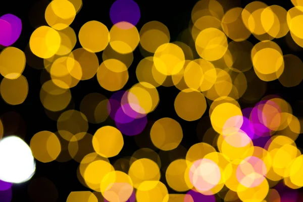 Abstrato amarelo roxo luzes bokeh fundo — Fotografia de Stock