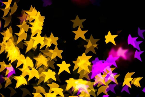Абстрактні жовті фіолетові вогні Зоряний фон боке — стокове фото