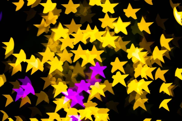 Abstrato Amarelo Roxo luzes Estrela bokeh fundo — Fotografia de Stock