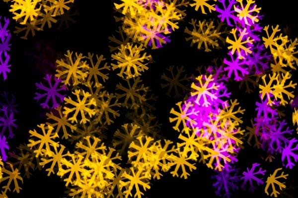 Abstract Yellow Purple lights snow flake bokeh background