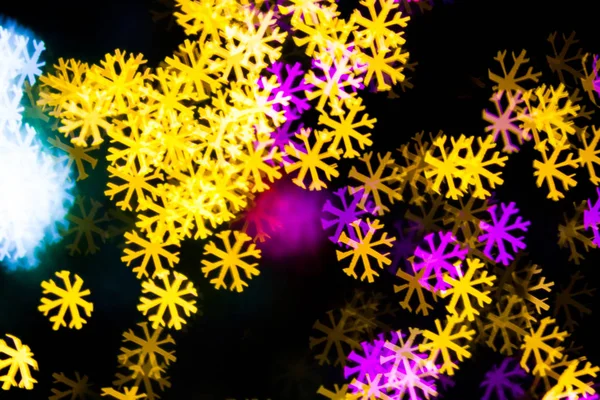 Abstrakt gul lila ljus snow flake bokeh bakgrund — Stockfoto