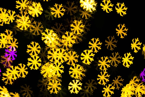 Abstract Yellow Purple lights snow flake bokeh background