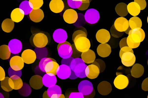 Abstrato amarelo roxo luzes bokeh fundo — Fotografia de Stock