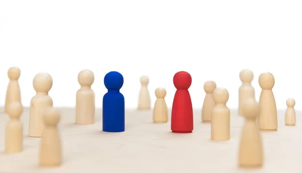 systemic, wooden board for family therapy. Wooden figures posing as people, a team or a family constellation