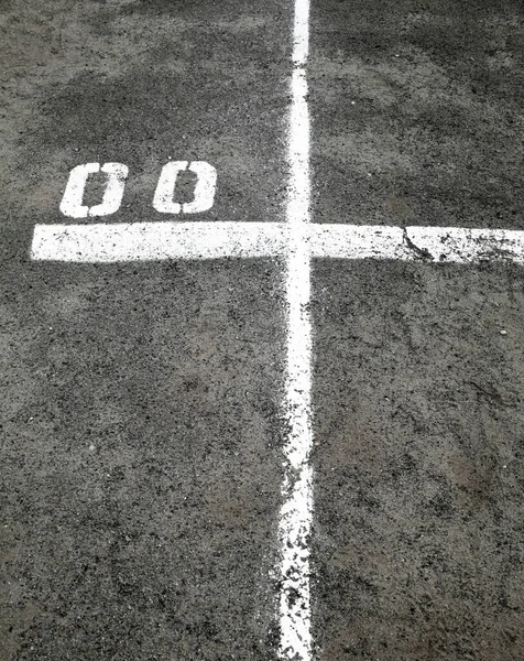 Marking lines and numbers on the asphalt surface — Stock Photo, Image