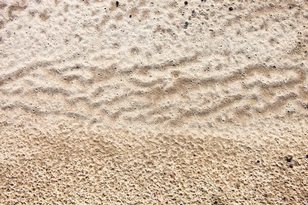 Yağmurdan sonra kum yüzeyi — Stok fotoğraf