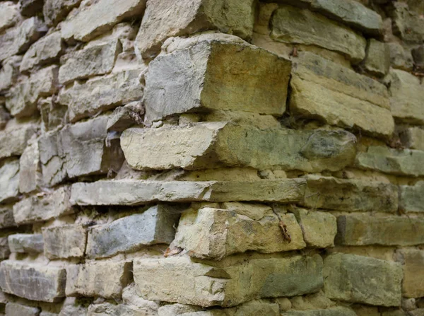 Stenen metselwerk hoek met rijke en diverse textuur — Stockfoto