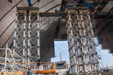 CHERNOBYL, UKRAINE -  OCTOBER 16, 2015: Construction of New Safe Confinement (or New Shelter) at Chernobyl Nuclear Power Plant over the nuclear reactor destroyed by Chernobyl disaster in 1986.