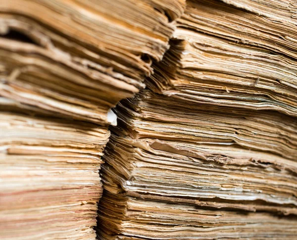 Stack of the old paper documents in the archive.