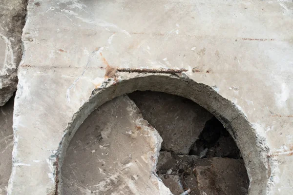 Concrete block with the manhole opening on the pile of damaged concrete blocks. — Stock Image Concrete Block Manhole Opening Pile Damaged Concrete Blocks Royalty Free Stock Images