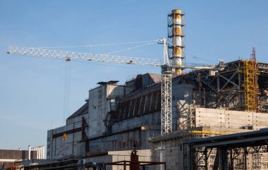 CHERNOBYL, UKRAINE -  OCTOBER 16, 2015: Construction of New Safe Confinement (or New Shelter) at Chernobyl Nuclear Power Plant over the nuclear reactor destroyed by Chernobyl disaster in 1986.