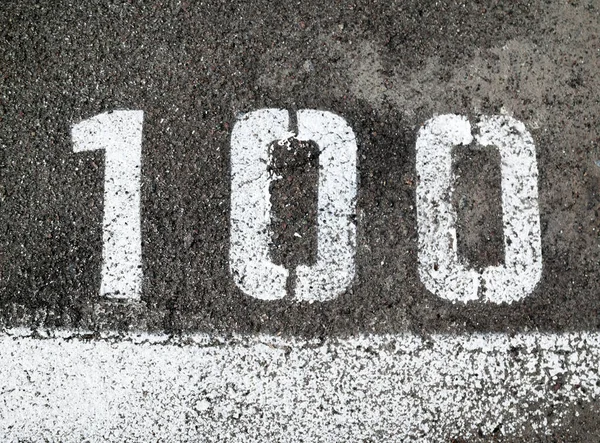 Number 100 Asphalt Surface Marking Line Close — Stock Photo, Image