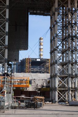 CHERNOBYL, UKRAINE -  OCTOBER 16, 2015: Construction of New Safe Confinement (or New Shelter) at Chernobyl Nuclear Power Plant over the nuclear reactor destroyed by Chernobyl disaster in 1986.
