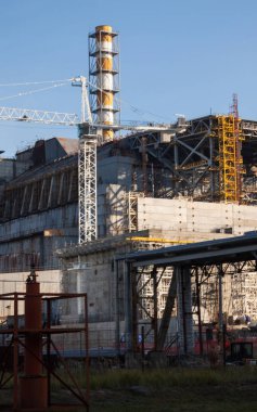 CHERNOBYL, UKRAINE -  OCTOBER 16, 2015: Construction of New Safe Confinement (or New Shelter) at Chernobyl Nuclear Power Plant over the nuclear reactor destroyed by Chernobyl disaster in 1986.