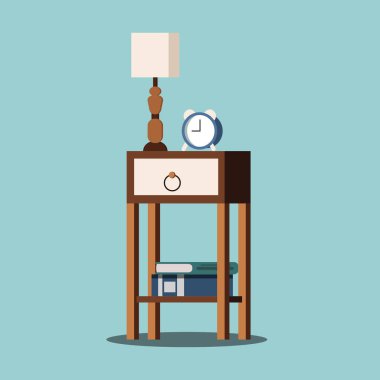 Lamba, çalar saat ve kitaplarla izole edilmiş komodin..