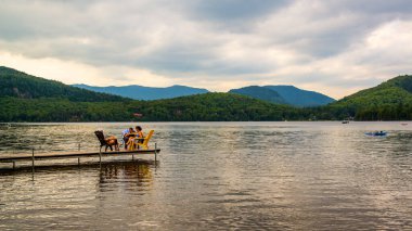  Canada - June 20 ,2018: people resting on lake in Park of Nature in Laval