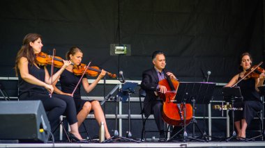 Saint Hubert, Canada - July 28, 2019: Quartet band playing in the Parc de la Cite in Saint Hubert