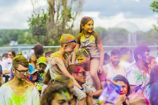 Montreal, Canada - August 10, 2019: People celebrate HOLI Festival throwing color powders in Horloge Park in Montreal