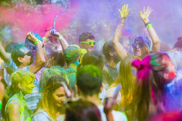 Montreal, Canada - August 10, 2019: People celebrate HOLI Festival throwing color powders in Horloge Park in Montreal