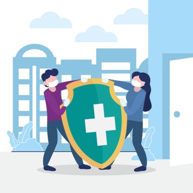 Erkek ve kadın büyük bir kalkanla Coronavirus 'la savaşıyor.