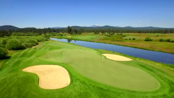 Aerial View Golf Course Surrounded Water Green Landscape Mountains — Stock Video