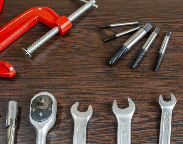 metal keys and fixtures for locksmithing on the table