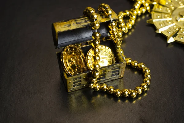 pirate treasure chest, close-up of a pirate gold medallion with necklace