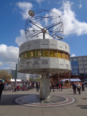 Berlin, Germany  - 21st April, 2017: World Clock on Alexanderplatz with tourist around.