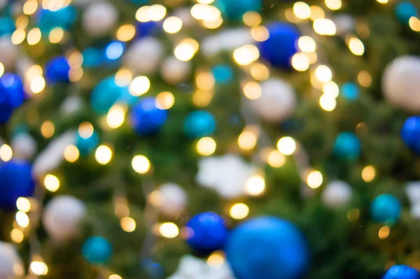 Luzes de Natal bokeh dourado e azul — Fotografia de Stock