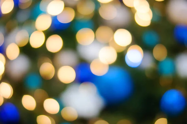 Luzes de Natal bokeh dourado e azul — Fotografia de Stock