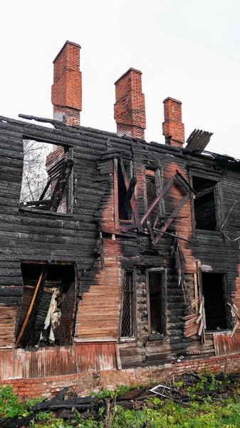 Burnt wooden residential house