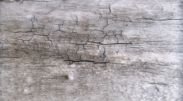 Cracked wooden desk textured surface — Stockfoto