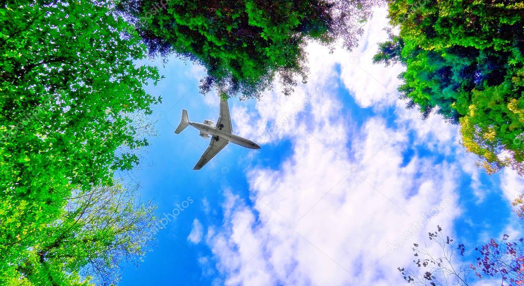 Vibrant wide angle view of aircraft flight in cloudy sky