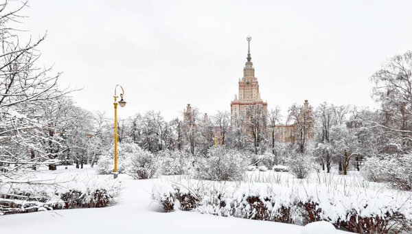 Vibrant view of white winter campus of famous Russian university with snowed trees in Moscow