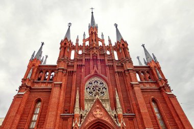 Moscow / Russia - April 30 2019: Nice architecture of famous Catholic Cathedral of The Immaculate Conception of The Blessed Virgin Mary in Moscow under dramatic sky