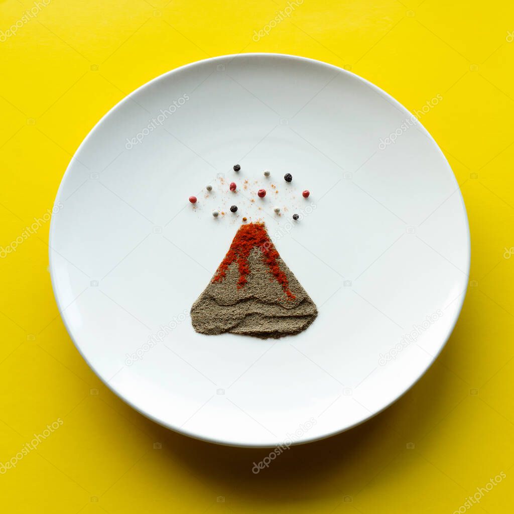 erupting volcano lined with ground pepper and peppercorns