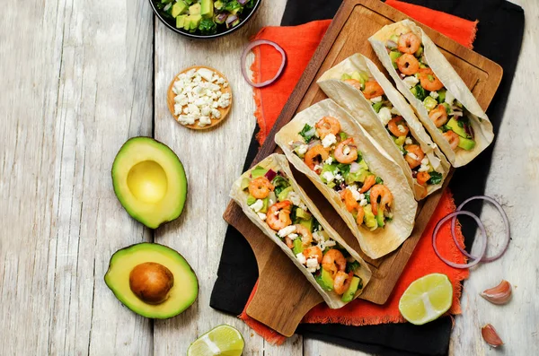 Shrimp tacos with avocado salsa