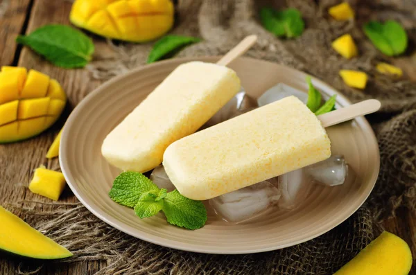 Creamy mango ice cream with fruits and ices