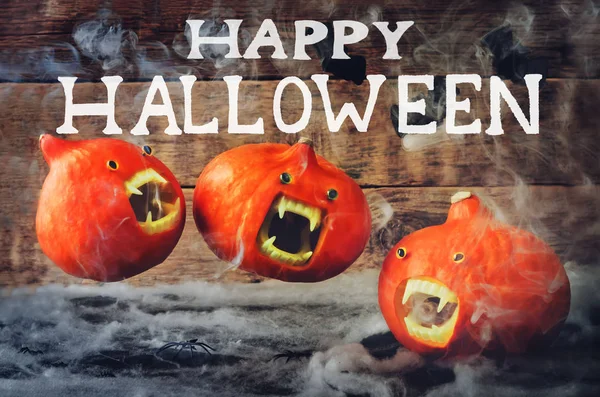 Happy Halloween words with flying pumpkins