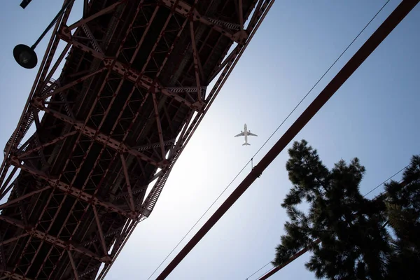 25 april bridge and flying plane. Photo of flying plane