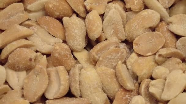 Fried salted peanuts rotates. View from above. — Stockvideo