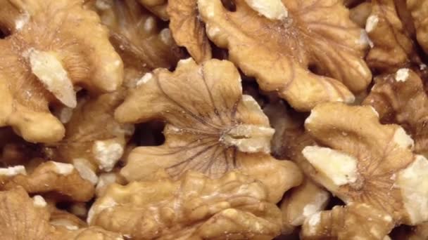 Walnut close up. product rich in minerals and vitamins. Walnut turns in a shot. Walnut kernels rotating. walnut close up lies under beams of the sun. Macro. Close up. — Stock Video