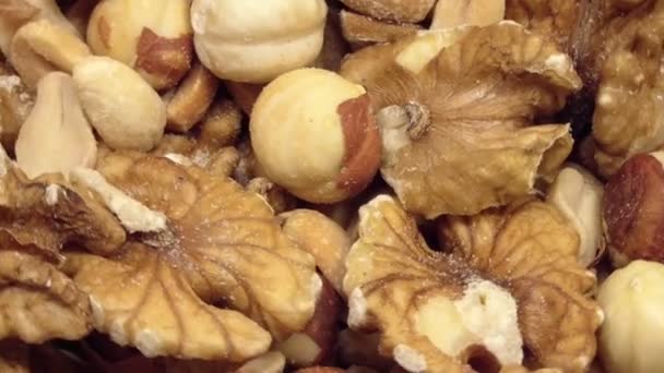 The mixture of nuts rotates. close up. View from above — Stock Video