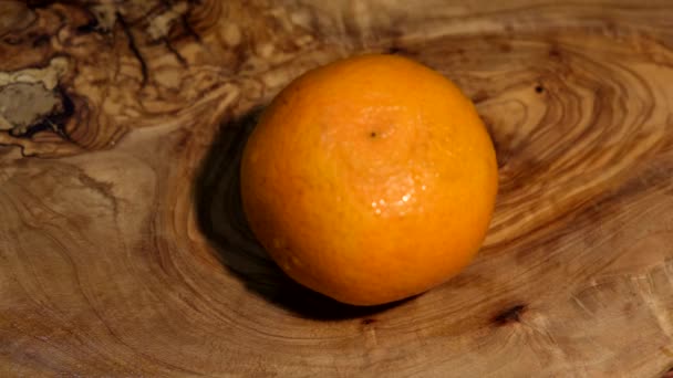 Man Cuts Tangerine Wooden Board Sharp Knife — Stock Video