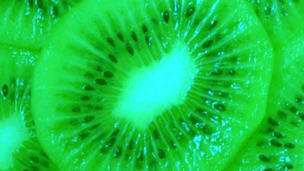 One fresh ripe cuted kiwi is spinning. The view from the top. Close-up. Macro. — Stock Video