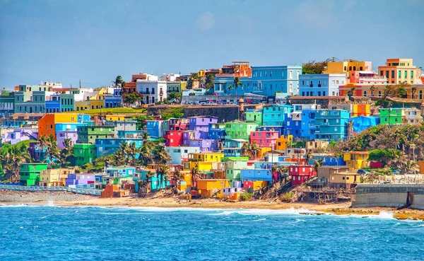 Colorful houses line the hillside over looking the beach in San Juan, Puerto Rico