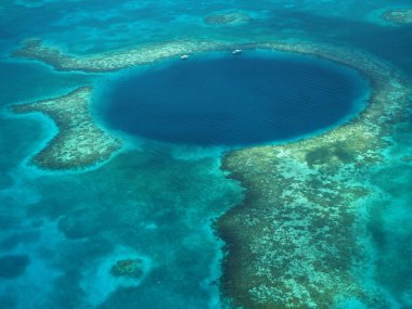 Flight over the Blue Hole in Belize. clipart