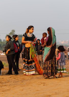 Pushkar, Rajasthan / India - November 2019 : Young indian girl in indian ethnic dress at pushkar camel fair